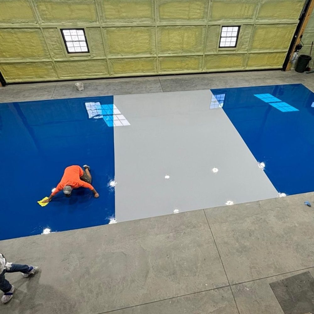 Blue and gray solid color epoxy floor installation in progress Kansas City MO
