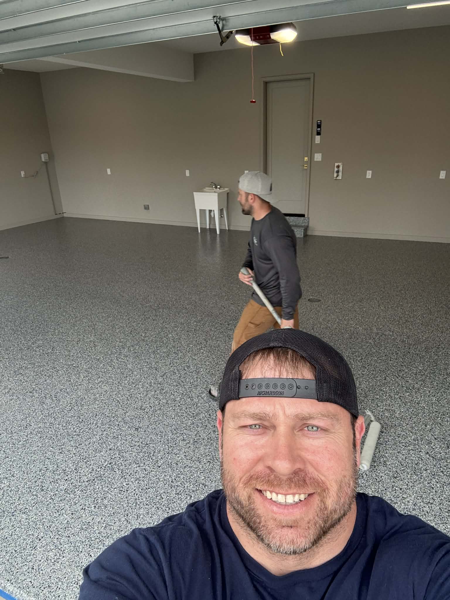 HH Next-Level Epoxy team on freshly installed epoxy garage floor Kansas City