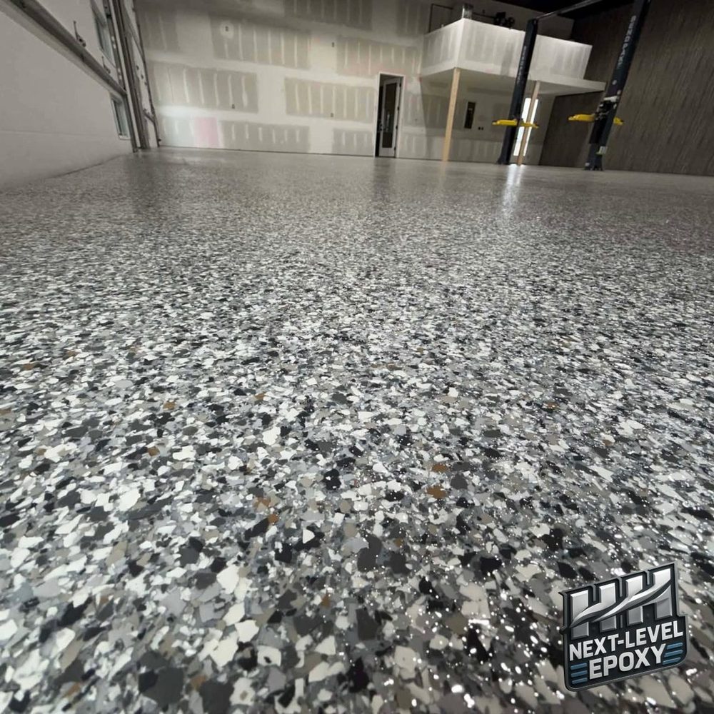 Large commercial shop epoxy flake floor Kansas City MO by HH Next-Level Epoxy